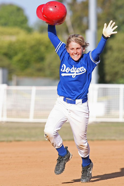 Nick Rivera celebrates his walk-off home run in the decisive game of the Mustang Division World Series last Thursday at the Field of Dreams.